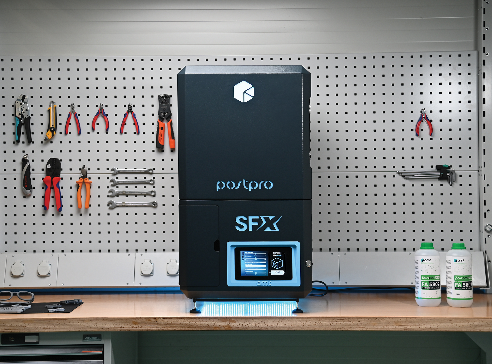 SFX desktop vapour smoothing machine for SLS 3D printed parts on a workshop bench